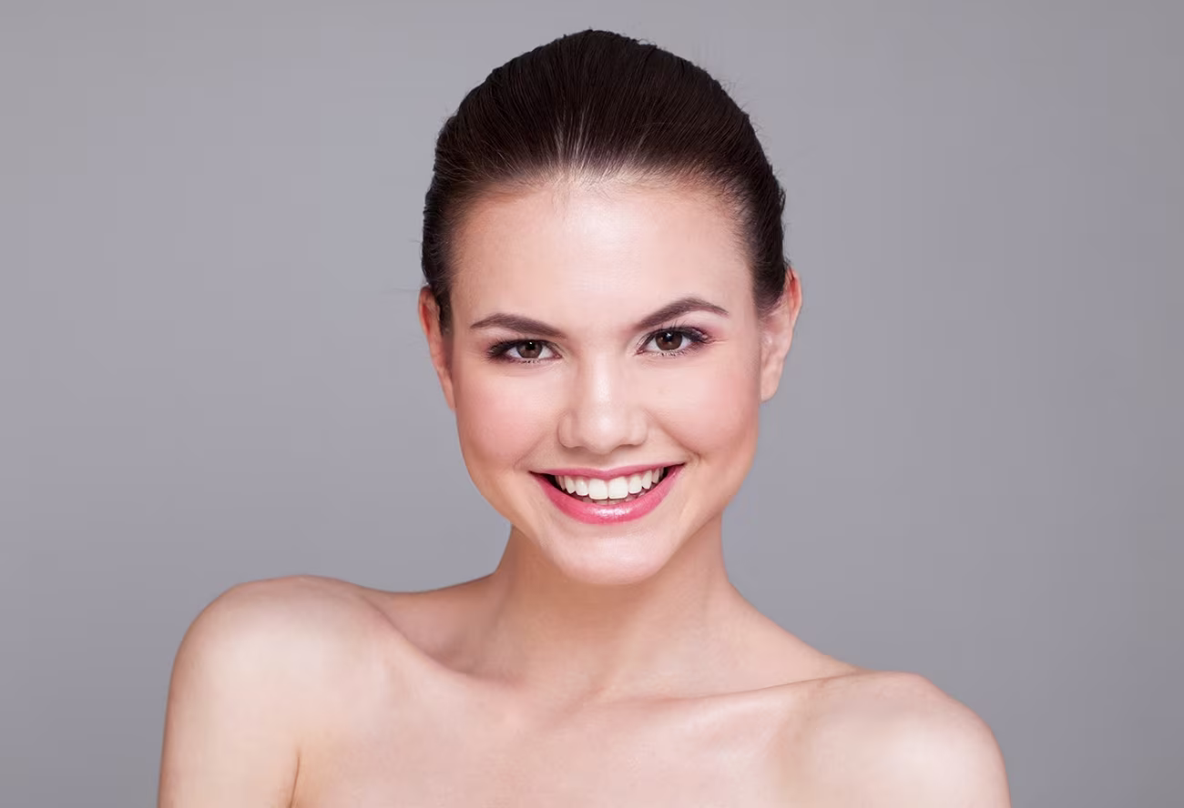 Woman with glowing skin after Morpheus8 treatment in Cincinnati, showcasing youthful, firm facial appearance