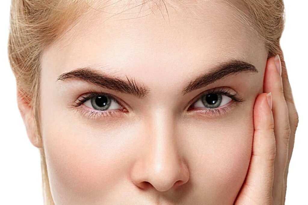 Close-up of bright eyes with smooth eyelids, representing functional and cosmetic blepharoplasty outcomes