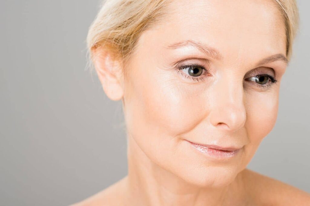Close-up of a woman’s eyelid area showing upper and lower blepharoplasty concerns