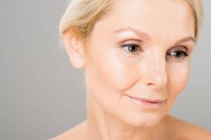 Close-up of a woman’s eyelid area showing upper and lower blepharoplasty concerns